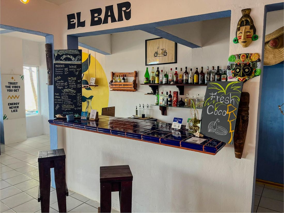 The bar at Pronoia beach house, Costa Maya, with the drinks board