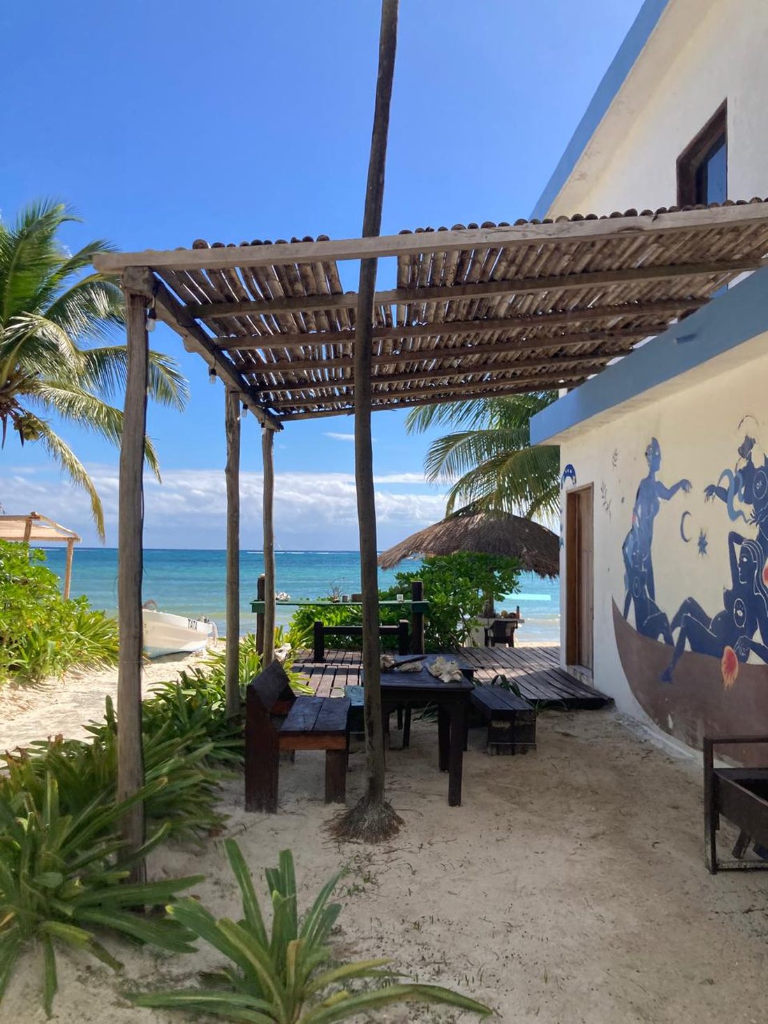 Shaded dining area facing the sea
